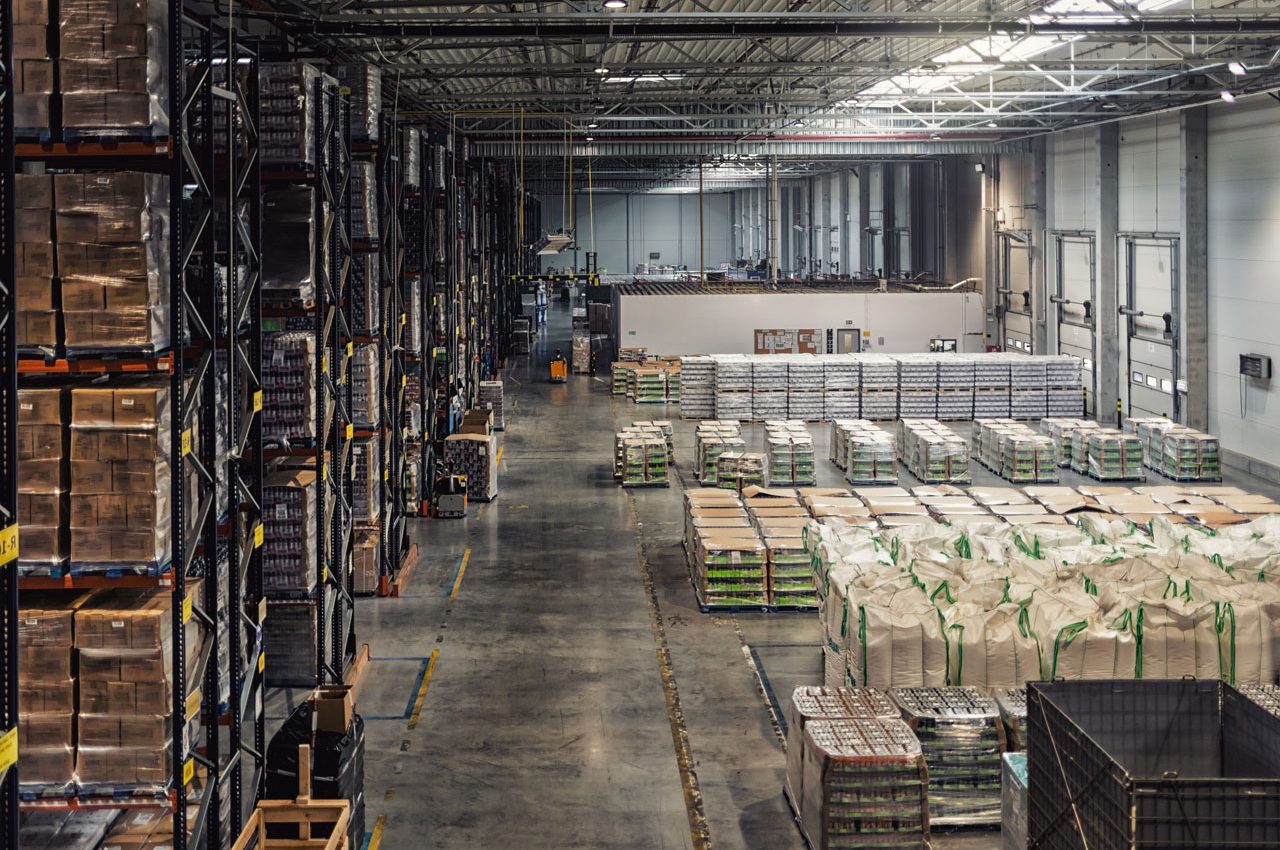 Huge distribution warehouse with high shelves, view from above